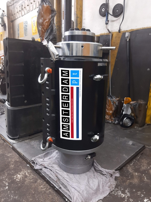 Hydraulic post tensioning jack manufactured by Amsterdam PT in workshop environment