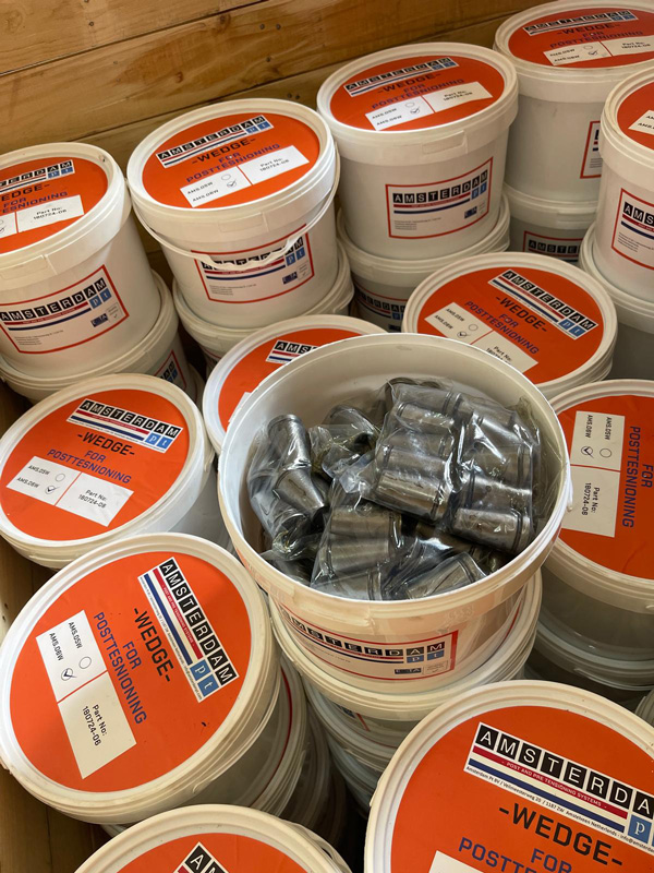 Post tensioning wedges stored in sealed plastic buckets for safe storage and handling