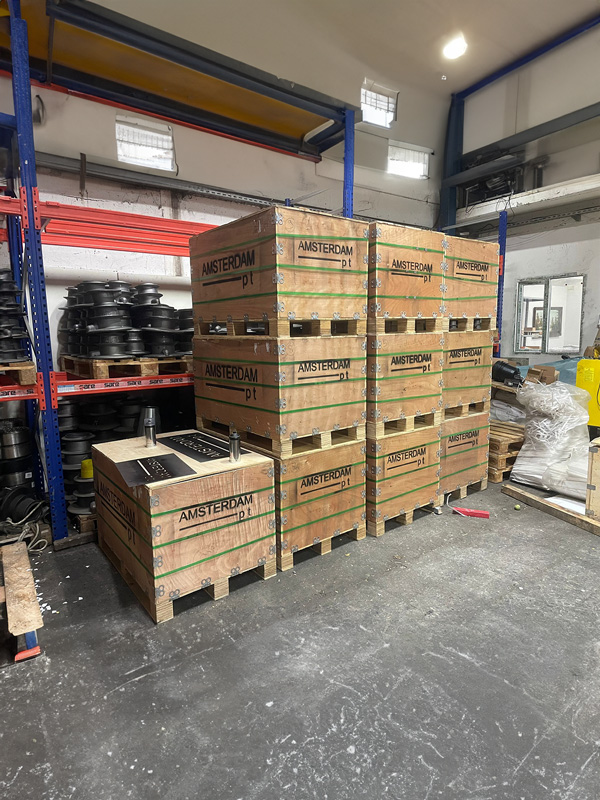 Post tensioning equipment packed in wooden crates inside Amsterdam PT warehouse