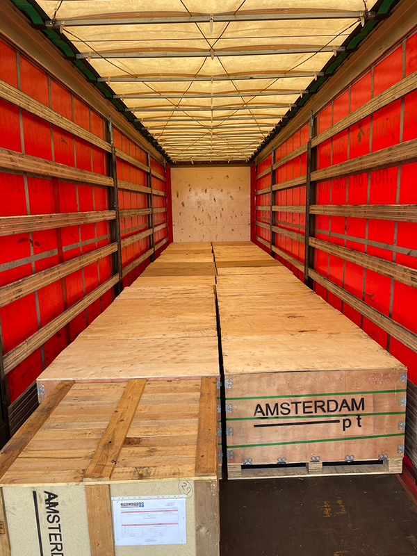 Crated Amsterdam PT post-tensioning equipment loaded inside transport truck for shipment